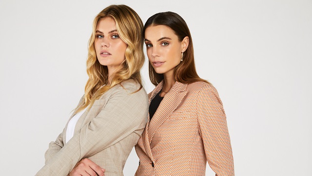 Image of two women wearing InStitchu's made to measure blazers.