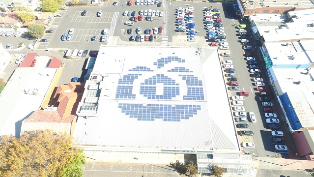 Image of solar panels in the shape of Woolworths' logo.