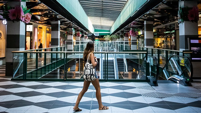 Image of a girl walking through Melbourne Central shopping centre