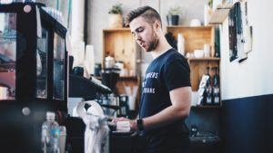 Image of male barista in cafe