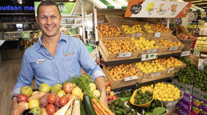 Tristan Harris co-CEO Harris Farm Markets holding box of fruit and veg