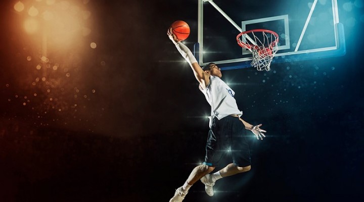 Image of basketball player doing a slam dunk