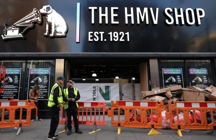 People stand outside the The HMV Shop at 383 Oxford Street, in London, Britain, November 20, 2023. REUTERS/Hollie Adams