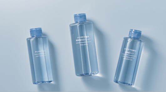 Bottles of toning water from Japanese homewares brand Muji against a blue background