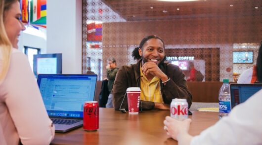 Customers of Costa coffee drinking Coca Cola beverages