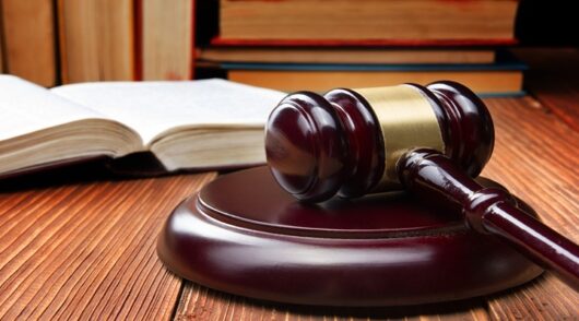 Image of gavel and book.