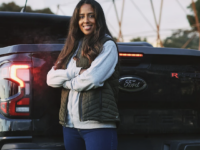 Image of woman standing by Raptor ute