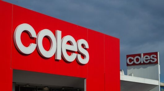 Image of Coles logo on building.