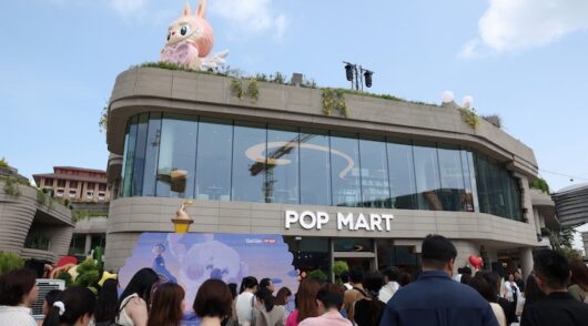 Guests wait to visit Pop Mart's first international bakery during their media day at Resorts World Sentosa in Singapore
