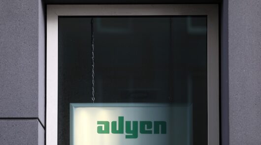 The Adyen logo is seen outside of the company's headquarters
