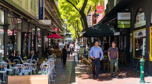 People walking and dining at Hardware Lane in Melbourne CBD.