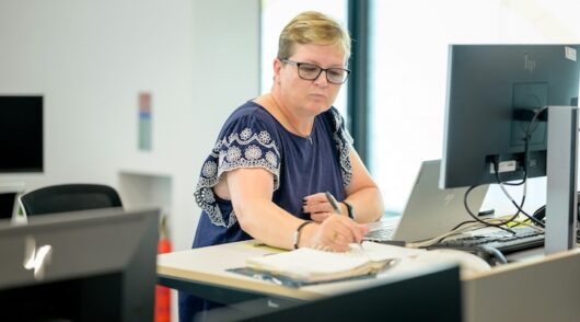 a bookkeeper working at a desk